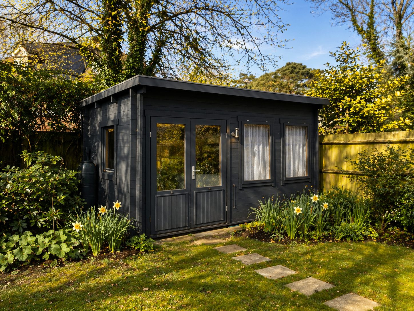 Highclere Wellness garden studio exterior surrounded by greenery